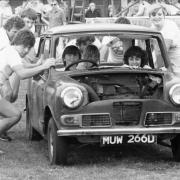 Marathon car push - competitors put their backs into a game at the Canvey ‘It’s a Knockout’ tournament in the 1980s