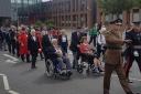 March - Veteran take part in parade