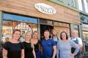 Team work – Rob Mears, centre, with Gerrie Walker and their staff outside the Squeeze cafe in Leigh
