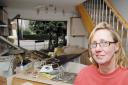 Flashback - Joanne Baur stands in her home the day after a car smashed into her kitchen
