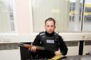 PC Gareth Ingram with the guns found in John Marsh's home