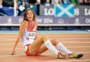 Jessica Judd sits on the track distraught after missing out on a medal in the Commonwealth Games 800m final