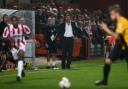Phil Brown watches on at Cheltenham Town on Tuesday night
