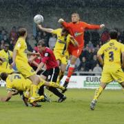 Neil Harris in the centre of the action against Torquay United