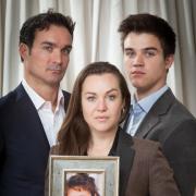 Manuel Fernandez with Celia Peachey and Benji Stubbings holding a picture of murdered Maria Stubbings