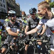 Mark Cavendish, left, talks to Chris Froome prior to the start of the first stage of the Tour de France