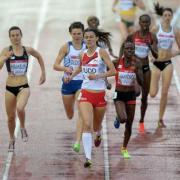 Jessica Judd wins her heat in the pouring rain at Hampden Park