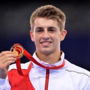Max Whitlock with his gold medal from his floor routine