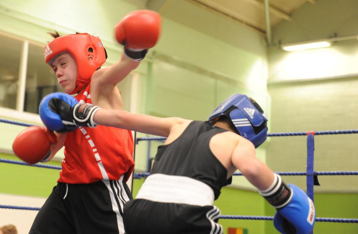 Boxing night at James Hornsby school, organised by Berry boxing club 
Red hat Charlie Pitty from Danson Boxing club and blue hat F Wood from Billericay ABC