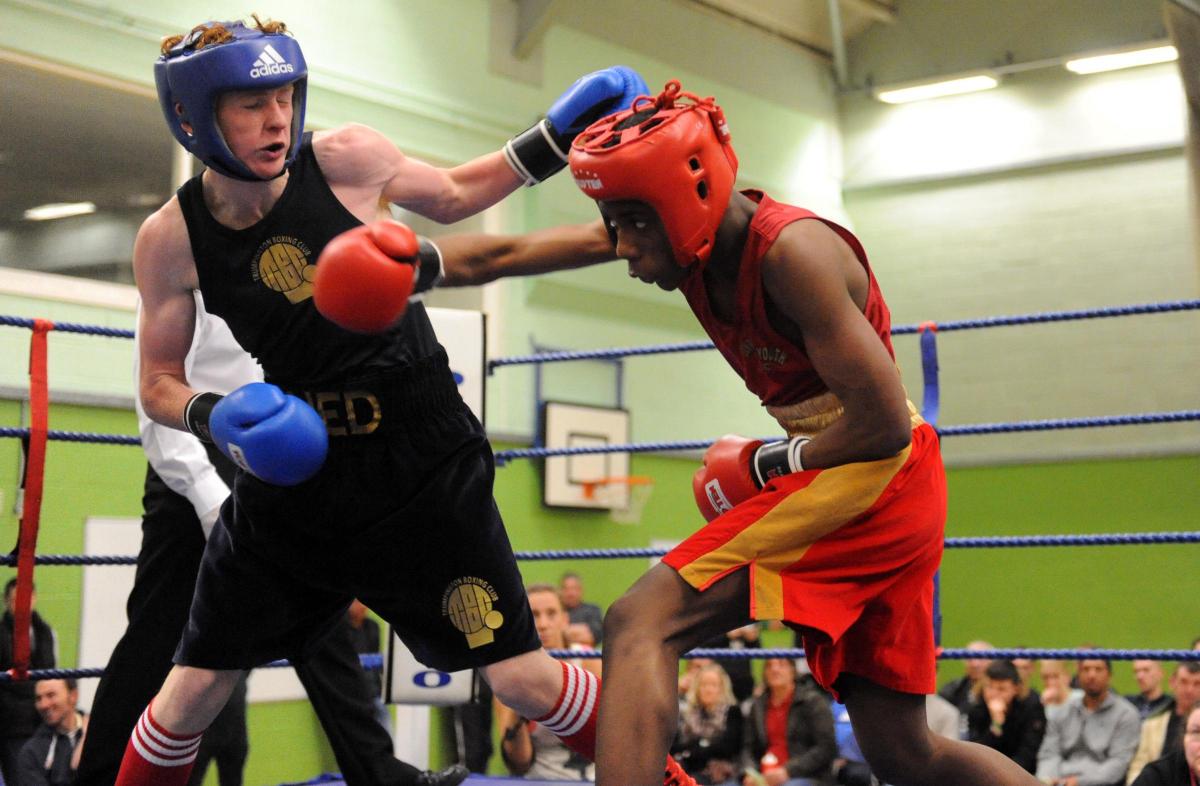 Boxing night at James Hornsby school, organised by Berry boxing club
F  Solom from Lansbury in the red hat v E Stevenson from Trumpington Abc in the blue hat