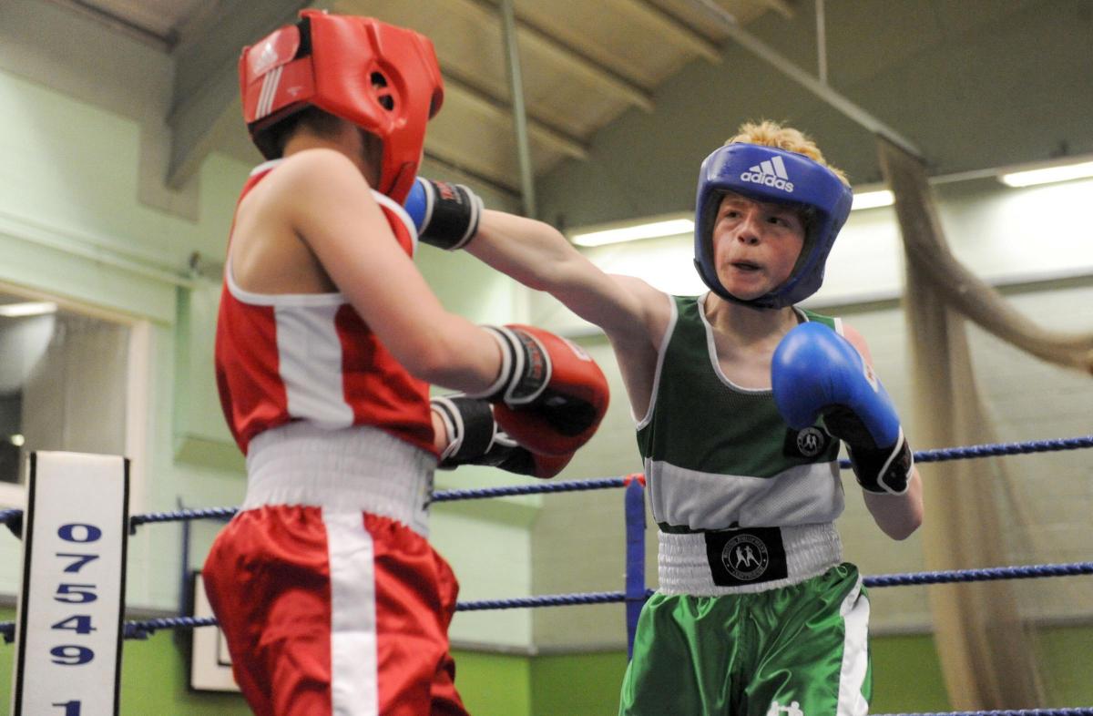 Boxing night at James Hornsby school, organised by Berry boxing club
Red hat Oliver Wilsher from Billericay ABC v blue hat Billy Forbes from Berry ABC