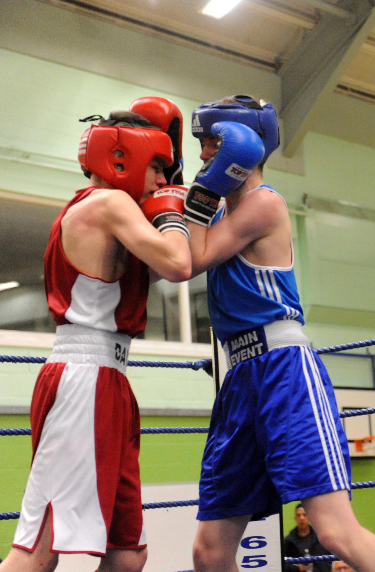 Boxing night at James Hornsby school, organised by Berry boxing club
red hat Danny Davis from Danson ABC v JAck McInerney from Billericay ABC in the blue hat
