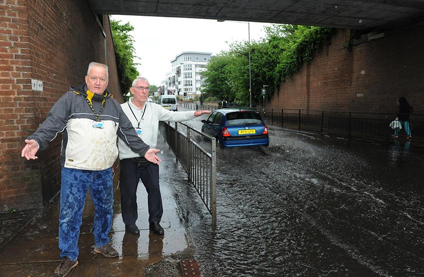 Taxi driver Ralph Morgan and Mark Waller fed up of the flooding under the bridge, nr Clay Hill road everytime it rains. PIC- L-R Mark Waller and Ralph Morgan