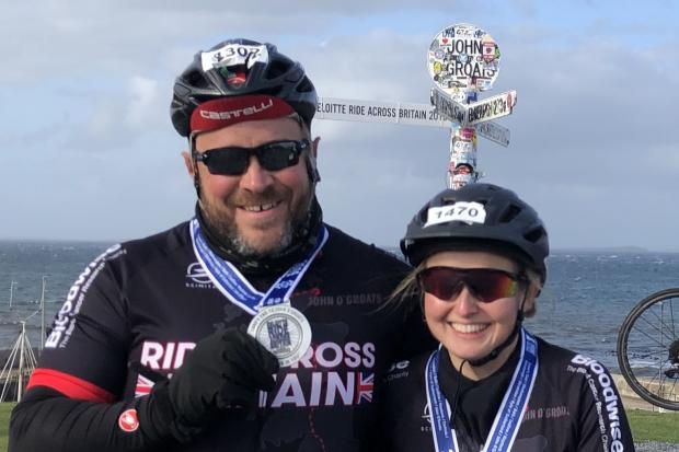 CROSS COUNTRY: James and Helen DeGiorgio at John o'Groats following their 980-mile cycle from Lands End