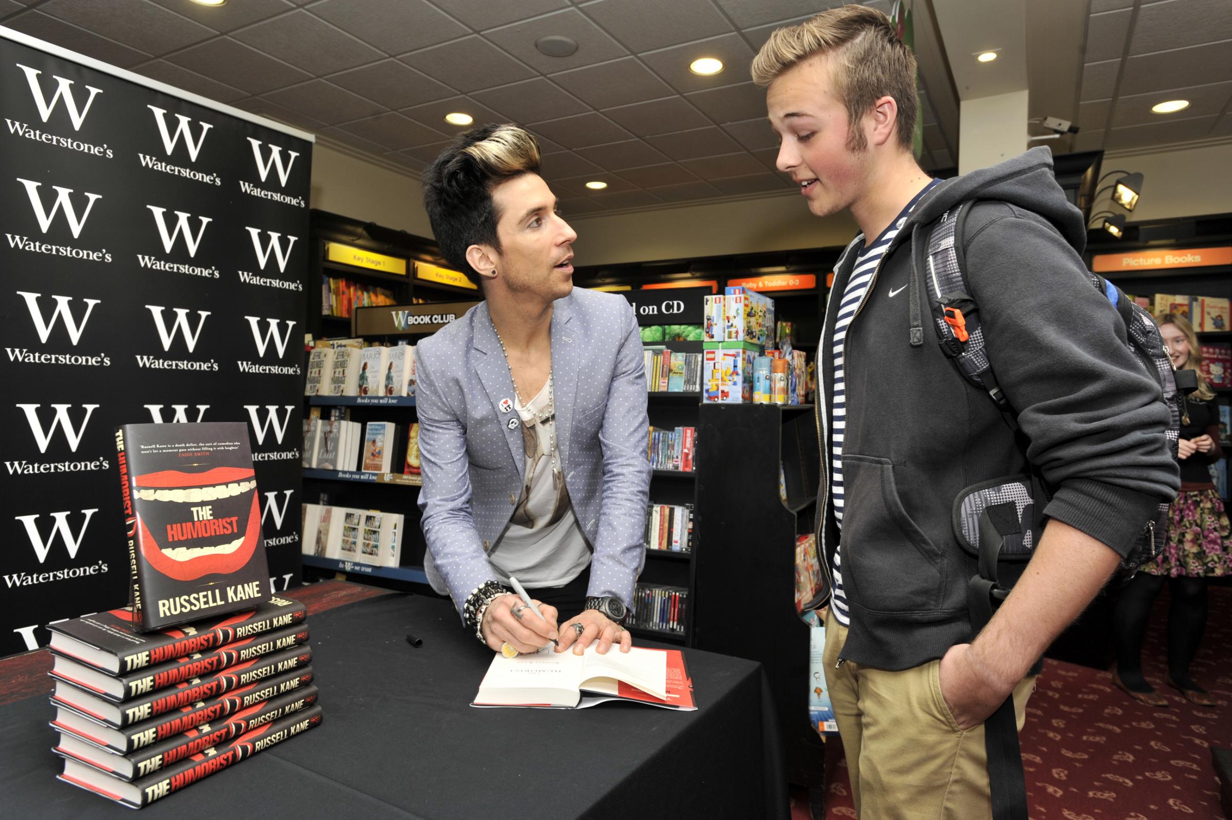 Meeting his idol - comedian Russell Kane chats with Rochford-based fan Alex Thraves while making an appearance at Southend High Streets Waterstones bookshop in May 2012