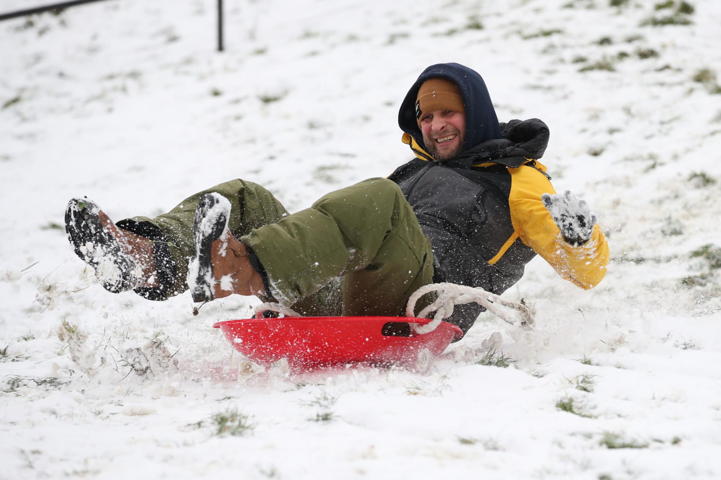 Daniel Smith sledging near the seafront at Southend. Picture: Yui Mok/PA Wire 