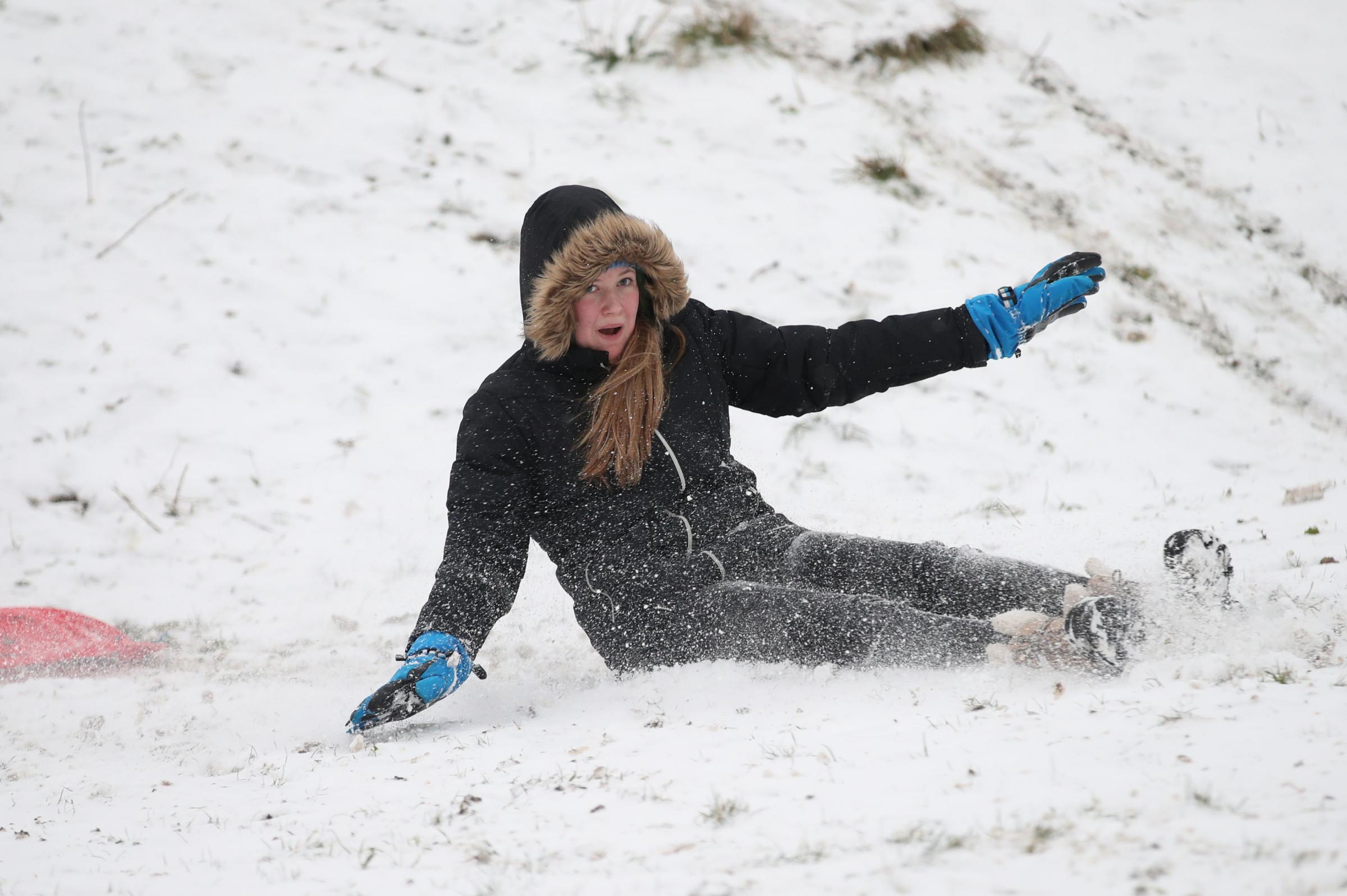 A woman sledging near the seafront at Southend. Picture: Yui Mok/PA Wire 