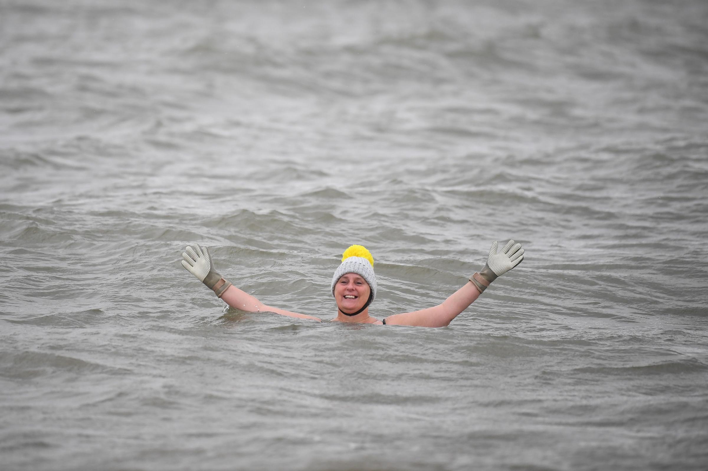 Swimmer Peta Hunter takes an early morning dip at Thorpe Bay. Picture: Victoria Jones/PA Wire 