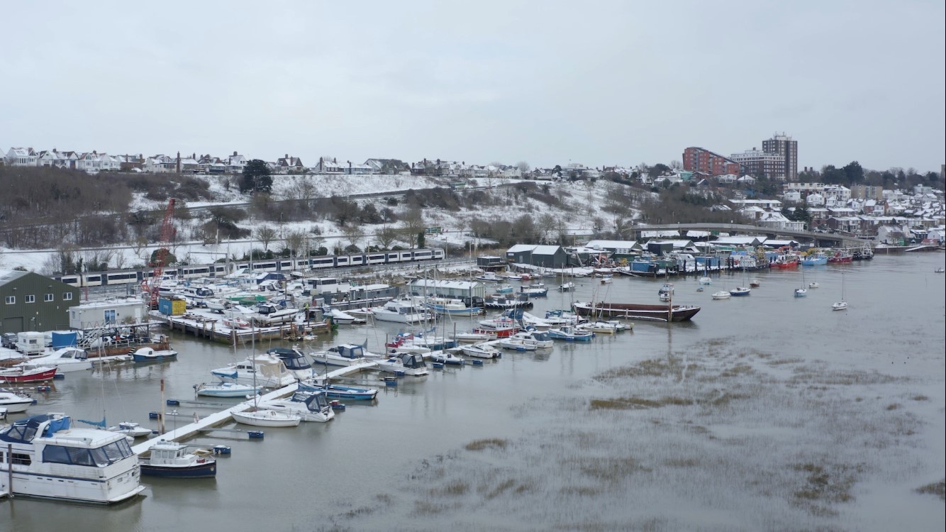 Marina - boats line-up as a c2c train passes Picture: ROSS BIRNIE