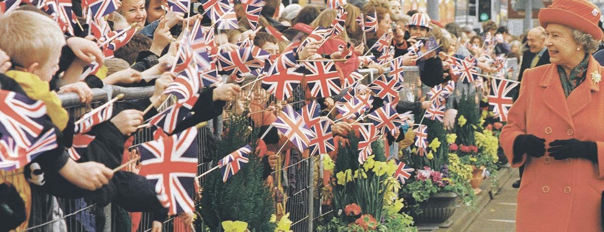 Well-wishers - the Queen sees countless members of the community waving their Union Jack flags during a trip to Southend in 1999