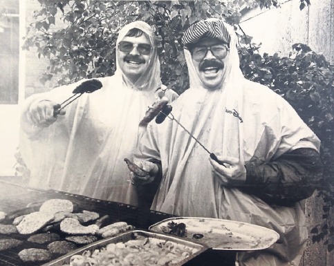 Ploughing on - Colin Stratton and Monty Rolph refused to let the heavens opening stop them from manning the barbecue at theThorpedene Primary School fete in May 1992