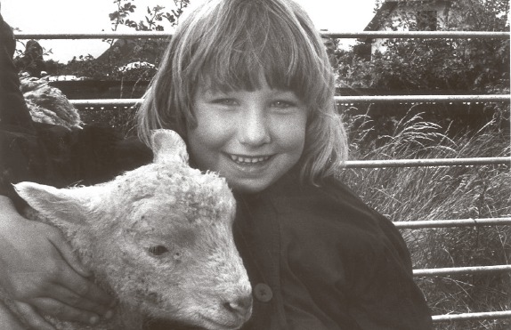 Sheepish - four-year-old Nicole Seabrook with Frisky the lamb at the park in 1990