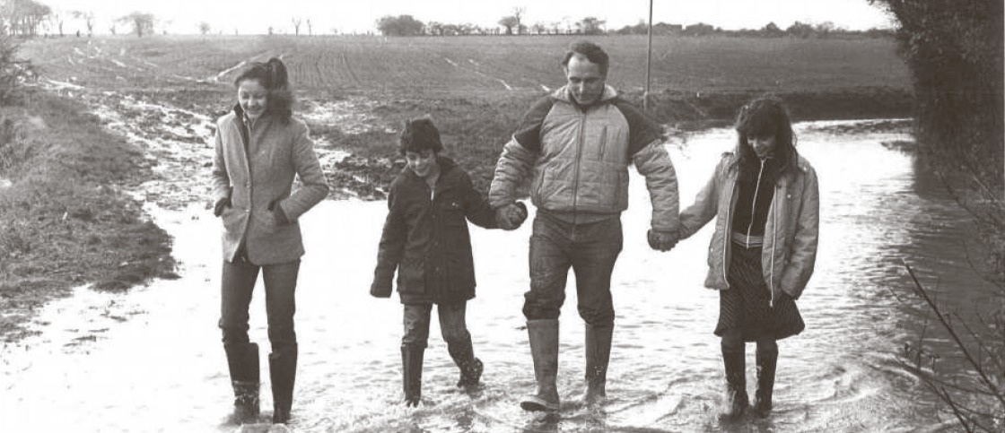 Got the wellies out - a family refused to let the floodwater stop them going on a walk in December 1982