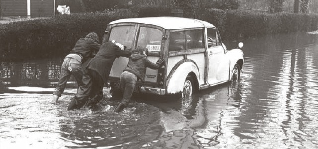 Pushing their way to their final destination - what motorists were made to contend with when Downham Road, Ramsden Heath, was flooded in 1972