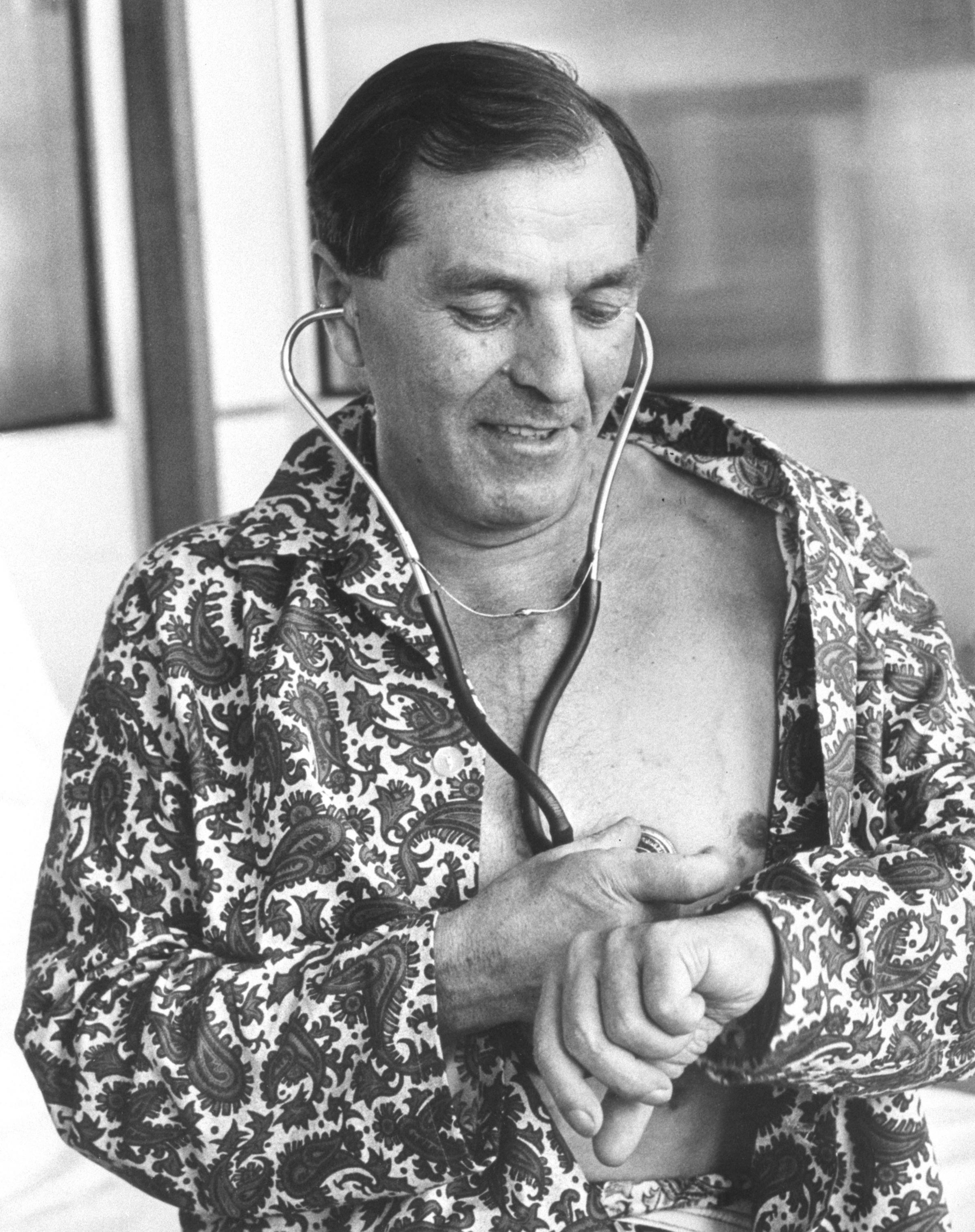 Looking for a beat - Frederick West checks his heart soon after undergoing the procedure in London