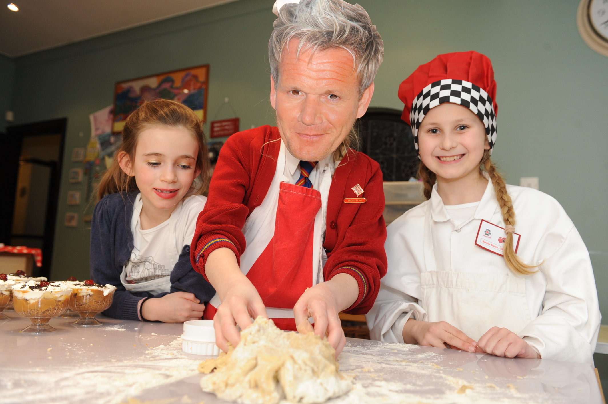 Famous face - Lucy Kent donned a Gordon Ramsay mask during a fundraising cooking class held in Westcliff 