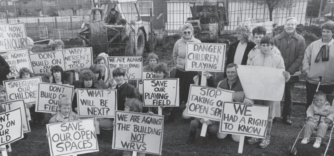 Clear message - islanders gather to campaign over plans to build on a playing field back in the 1980s