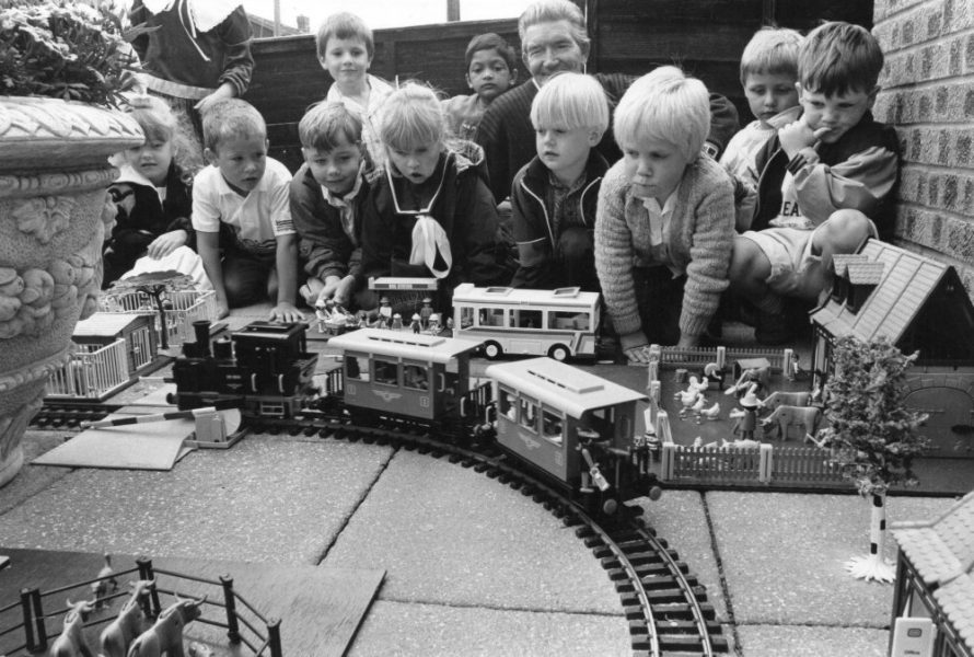 Watching on - youngsters are mesmerised by a train set which was placed outside the school building in 1990