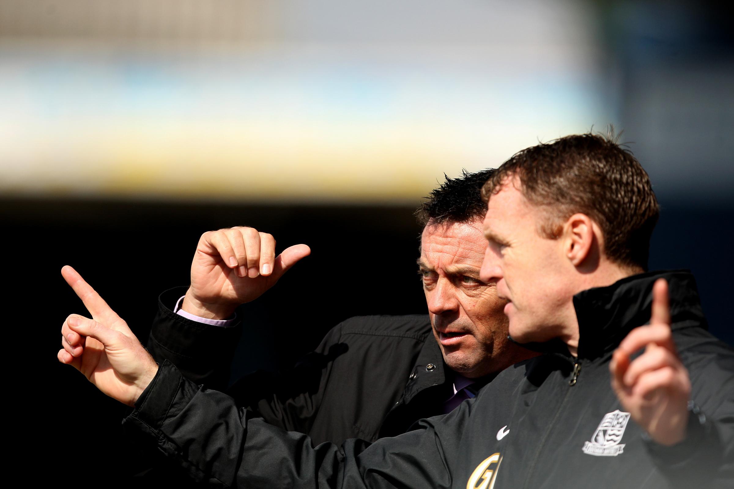 In communication - Phil Brown speaks with then-assistant manager Graham Coughlan on the Roots Hall touchline just a matter of days after his appointment in March 2013