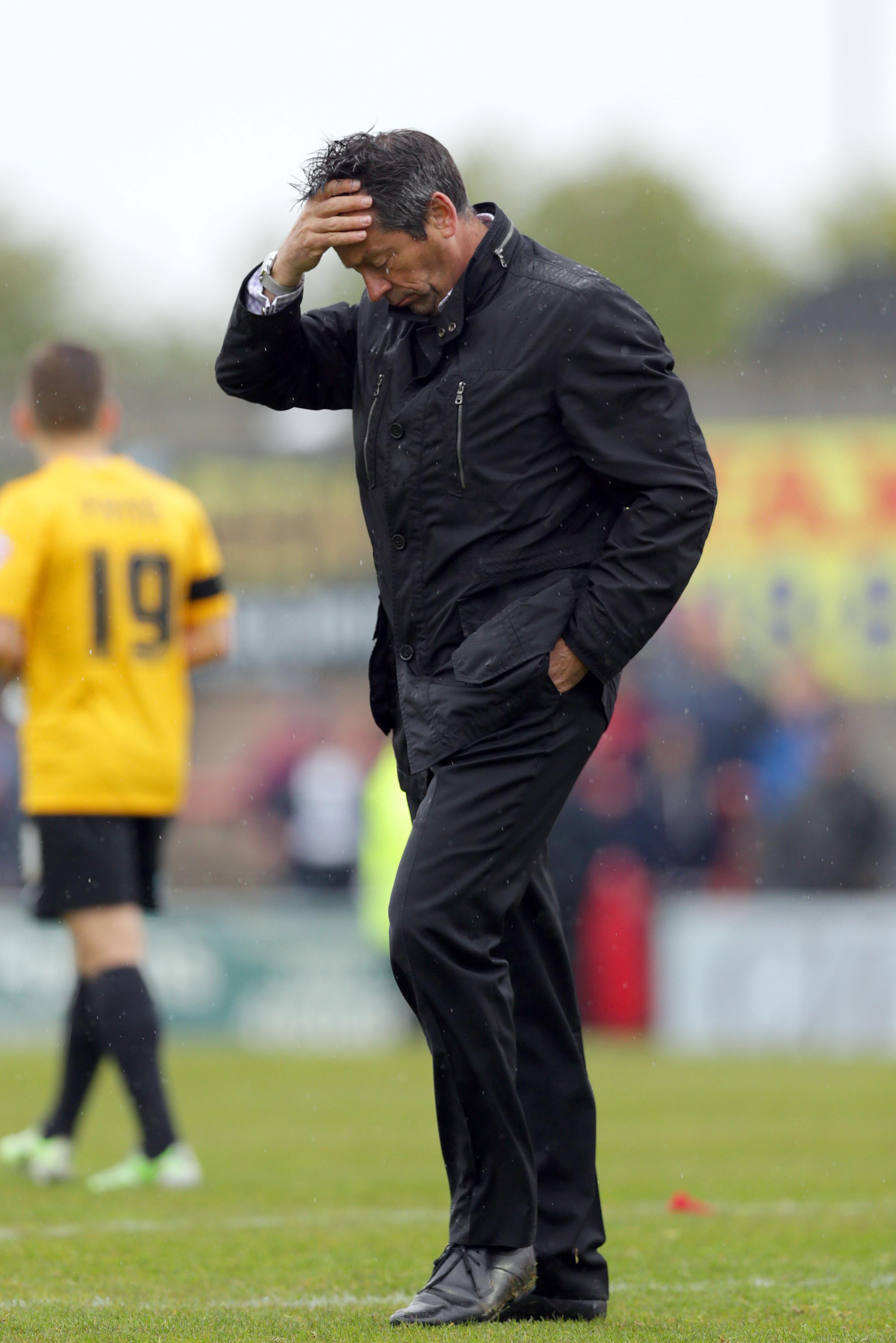 Low point - Phil Brown shows his dejection after Blues missed out on automatic promotion to League One following a 3-1 defeat at Morecambe in May 2015