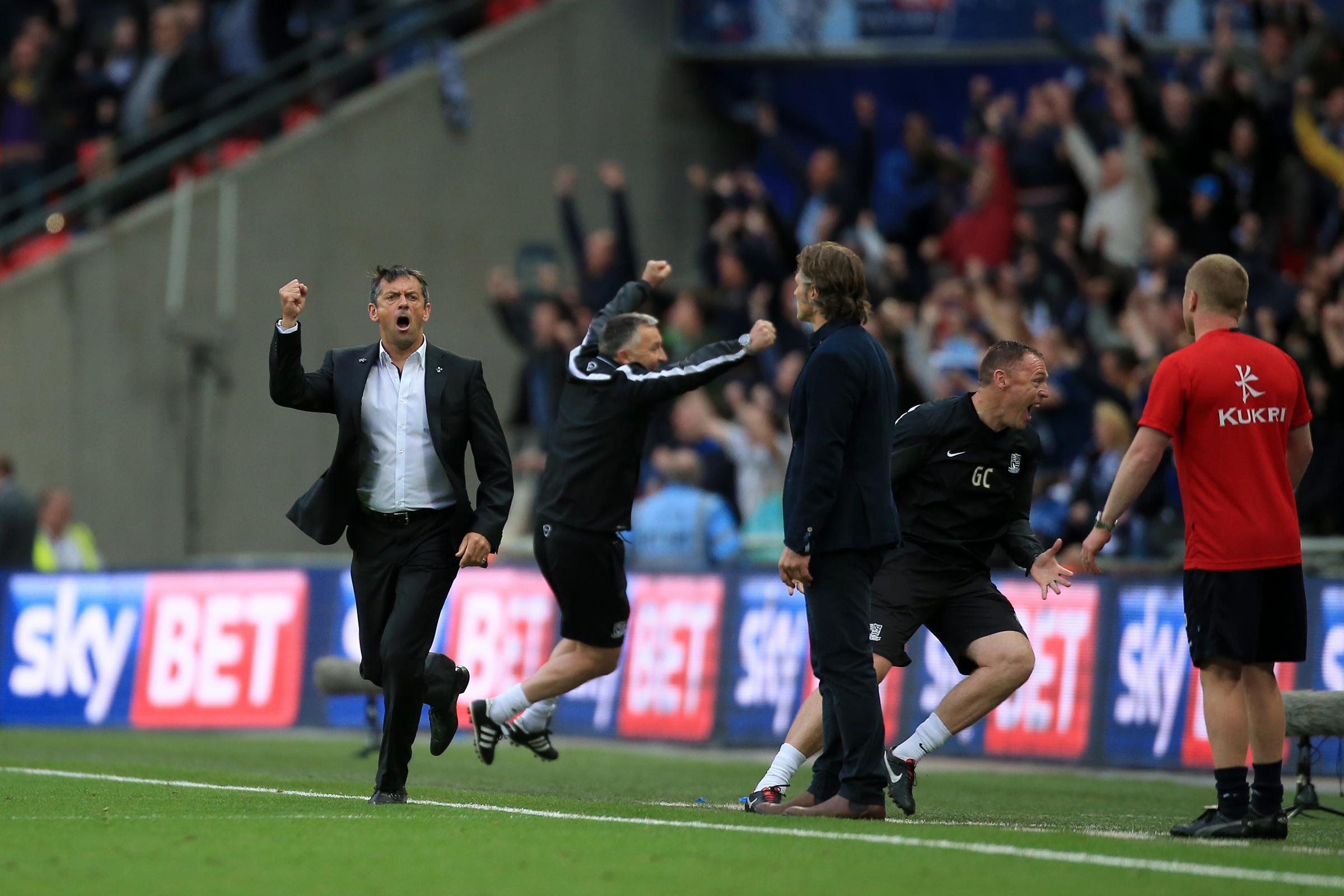 Jovial - Phil Brown runs onto the Wembley pitch after Joe Pigotts play-off final strike against Wycombe Wanderers in May 2015