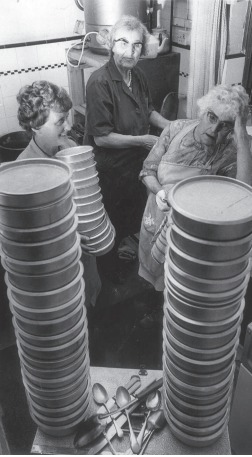In the kitchen - members roll up their sleeves in 1970