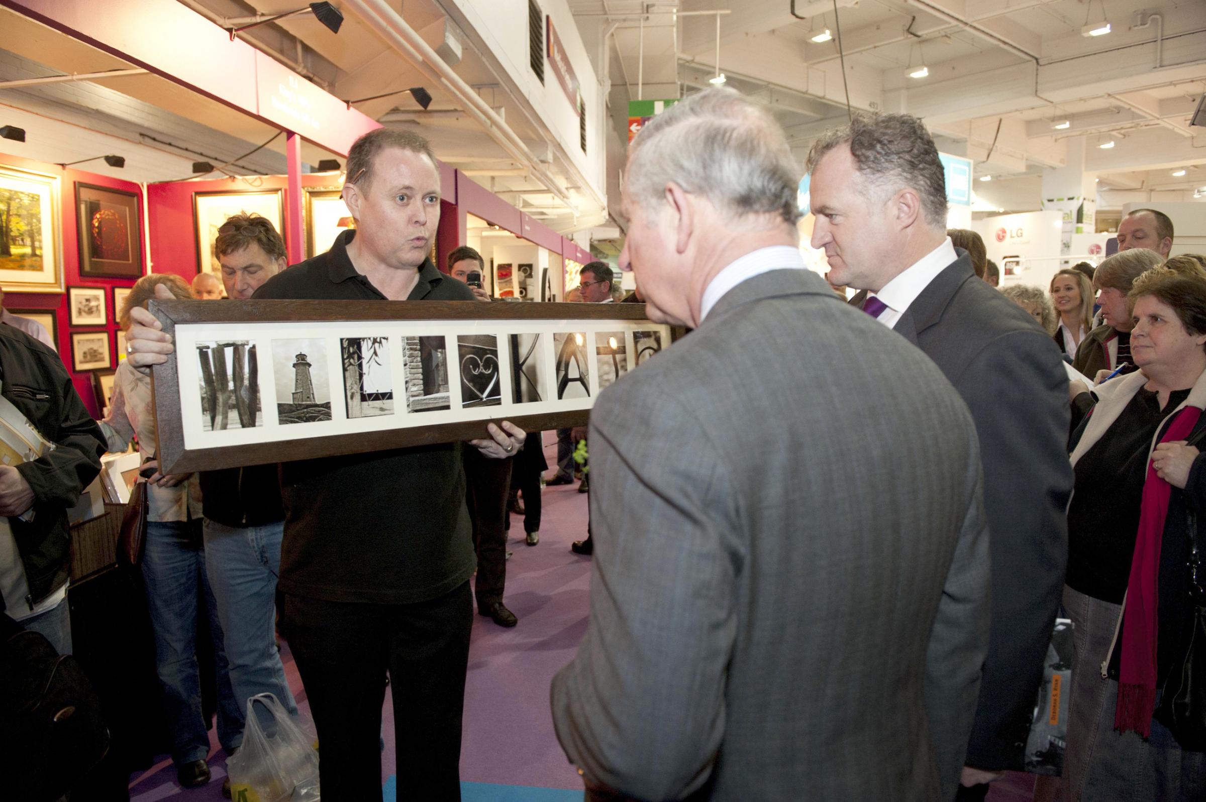 Present - Michael Wise presents Prince Charles with a wedding gift for Prince William and Kate