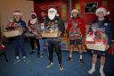 Bringing festive cheer - Billericay Town players and management staff handed hampers to the vulnerable Picture: NICKY HAYES