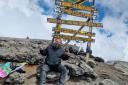 Fundraising - Lee Clark at the top of Kilimanjaro