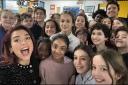 Dua Lipa with pupils at her old school in Hampstead and the DJ Greg James