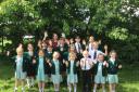 Celebrations - pupils and staff celebrating after the school's new SIAMS report