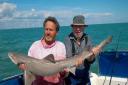 Mick Toomer gives guitar legend Peter Green a hand with his personal best 17lb smoothhound