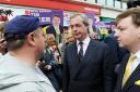 Nigel Farage and Tim Aker speak to residents in South Ockendon
