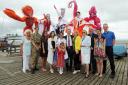 David Amess  launching the Alternative City Of Culture at Thames Estuary Yacht Club.Picturte of  David with deputy mayor Faye Evans , artists and stilt walkers from the Stiltwalker theatre school.
