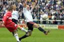 Darlington striker Barry Conlon attempts to block a clearance during Quakers' last match at Feethams in May 2003