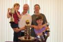 Pleased - Richard McEvoy and his family pose with the numerous trophies Picture: CHRIS RIDGWELL
