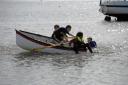 Heave ho – a group of determined youngsters on a rowing boat, who are taking part in the sea scouts’ creek race