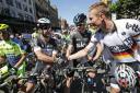 Mark Cavendish, left, talks to Chris Froome prior to the start of the first stage of the Tour de France