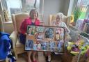 Centenarian Frances Munden and Anna Firth MP with the photo montage