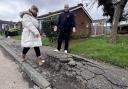 Andy Hillion and Jin Sharkey show pavement issues in Mistley Path, Basildon - pic by LDRS